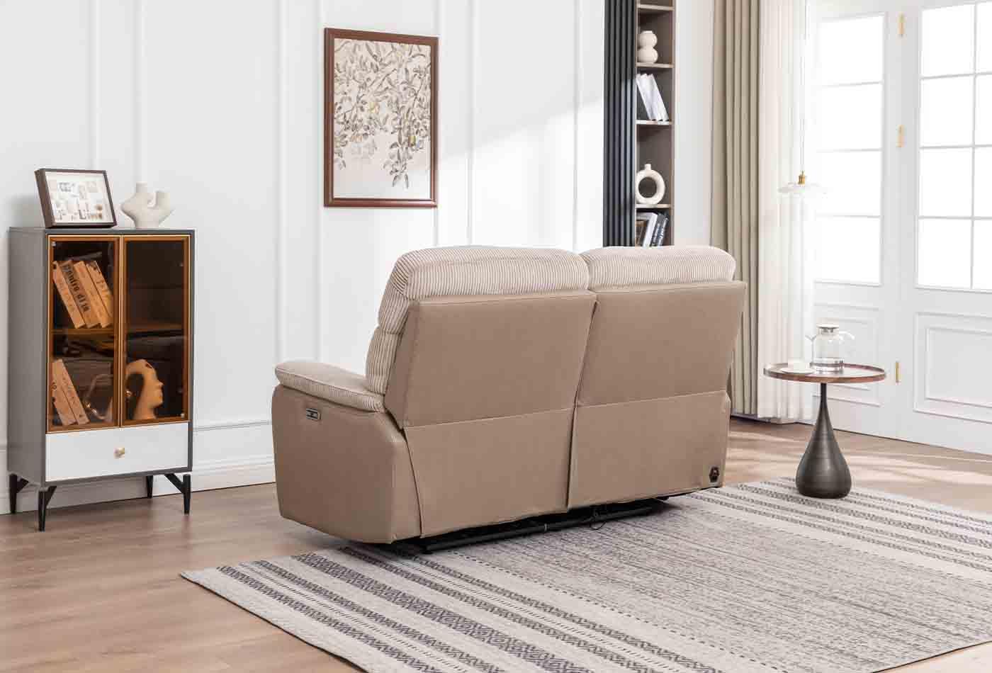 Beige two-seater loveseat with plush cushions in a modern living room setting, rear view