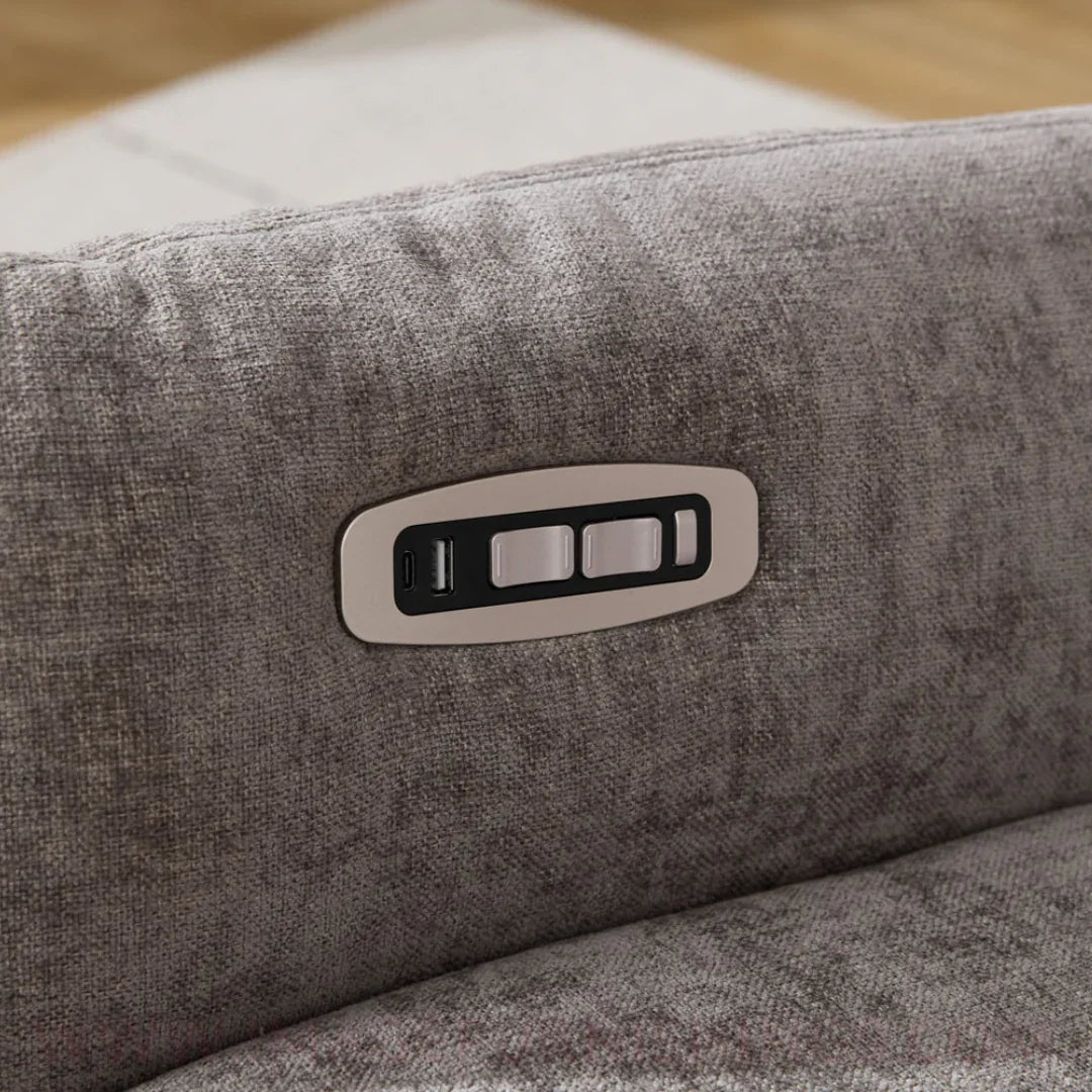 Close-up of grey swivel chair fabric with integrated control panel and USB port