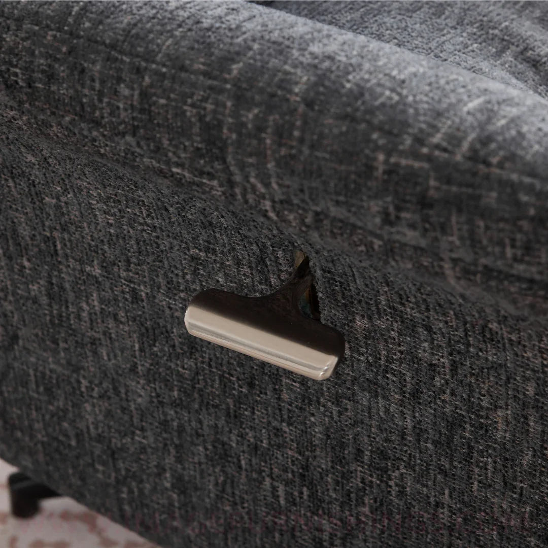 Closeup of Mira swivel chair dark grey upholstery with metal recliner lever