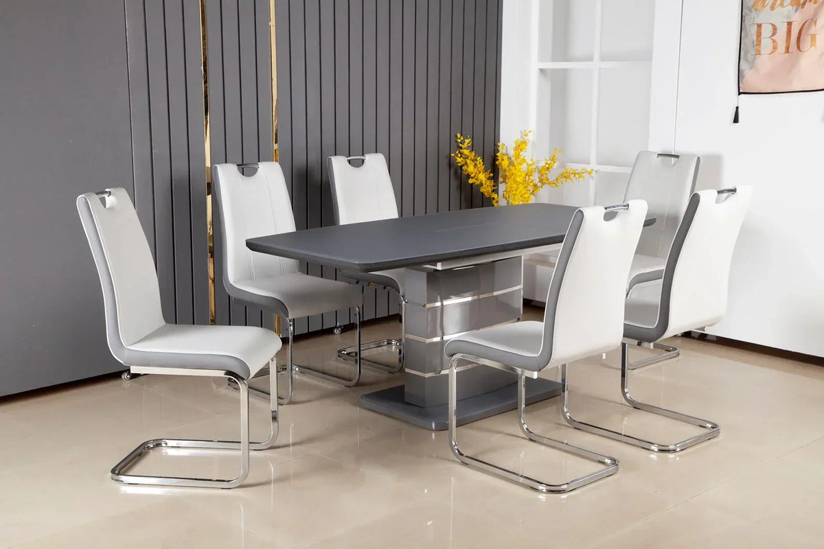 Dark grey extending dining table with six white chrome chairs in modern dining room