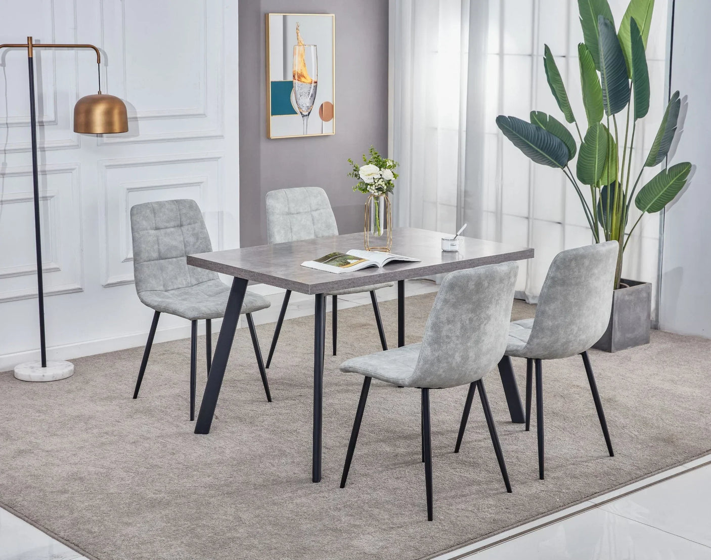 Rectangular marble dining table with grey upholstered chairs in modern living space