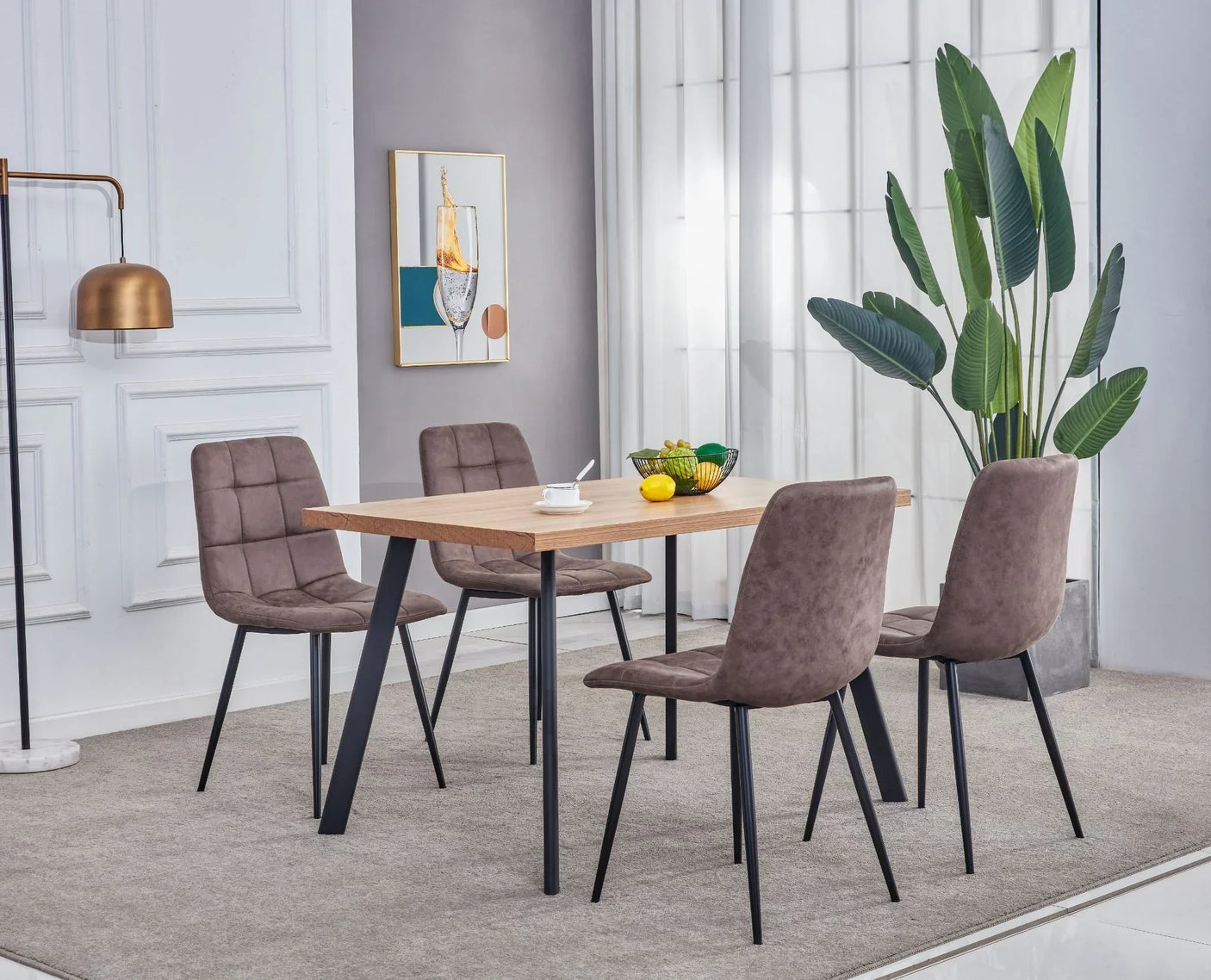 Rectangular oak dining table with four taupe chairs on a grey rug in modern dining room