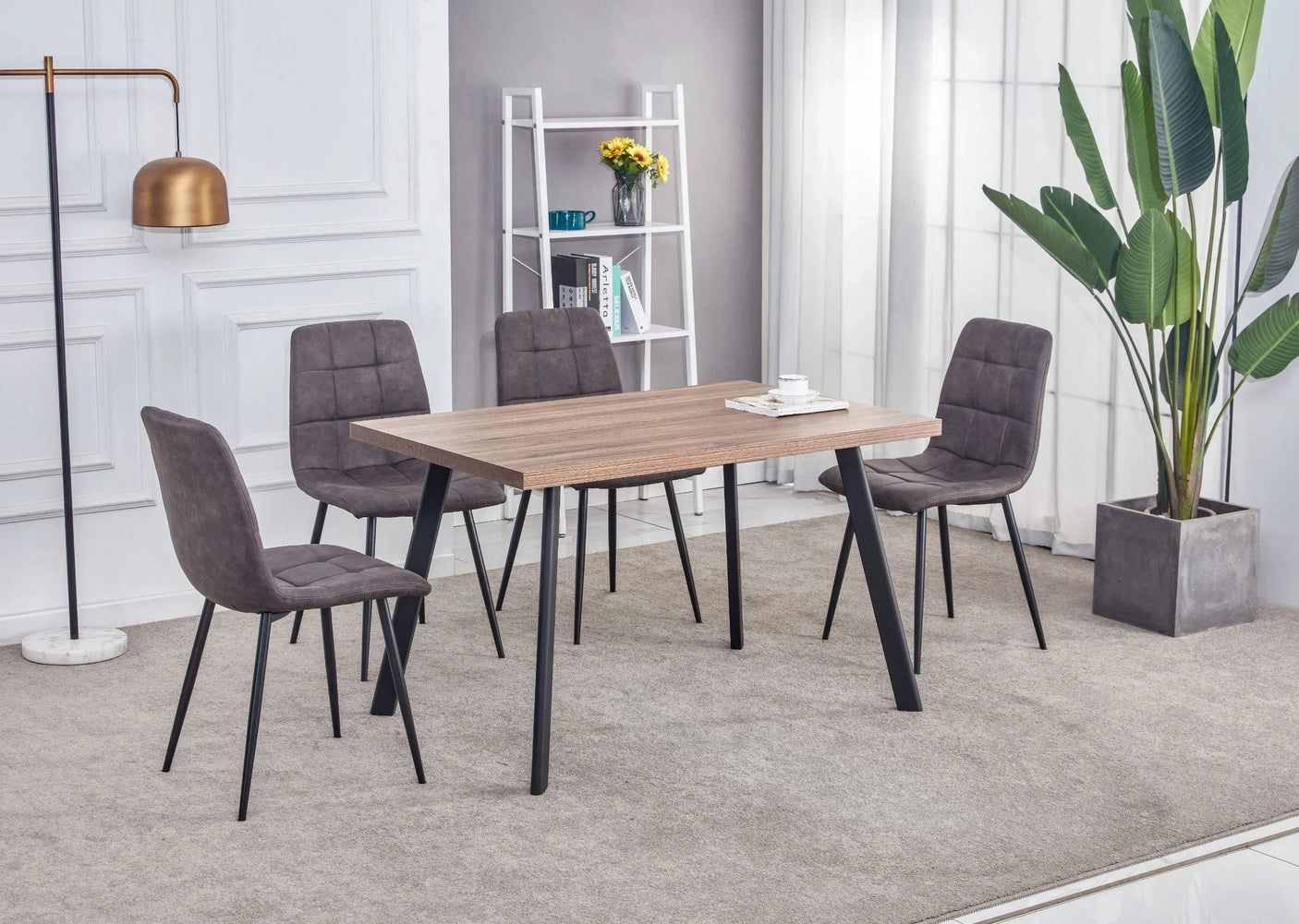Walnut dining table with black metal legs and four grey upholstered chairs in modern room
