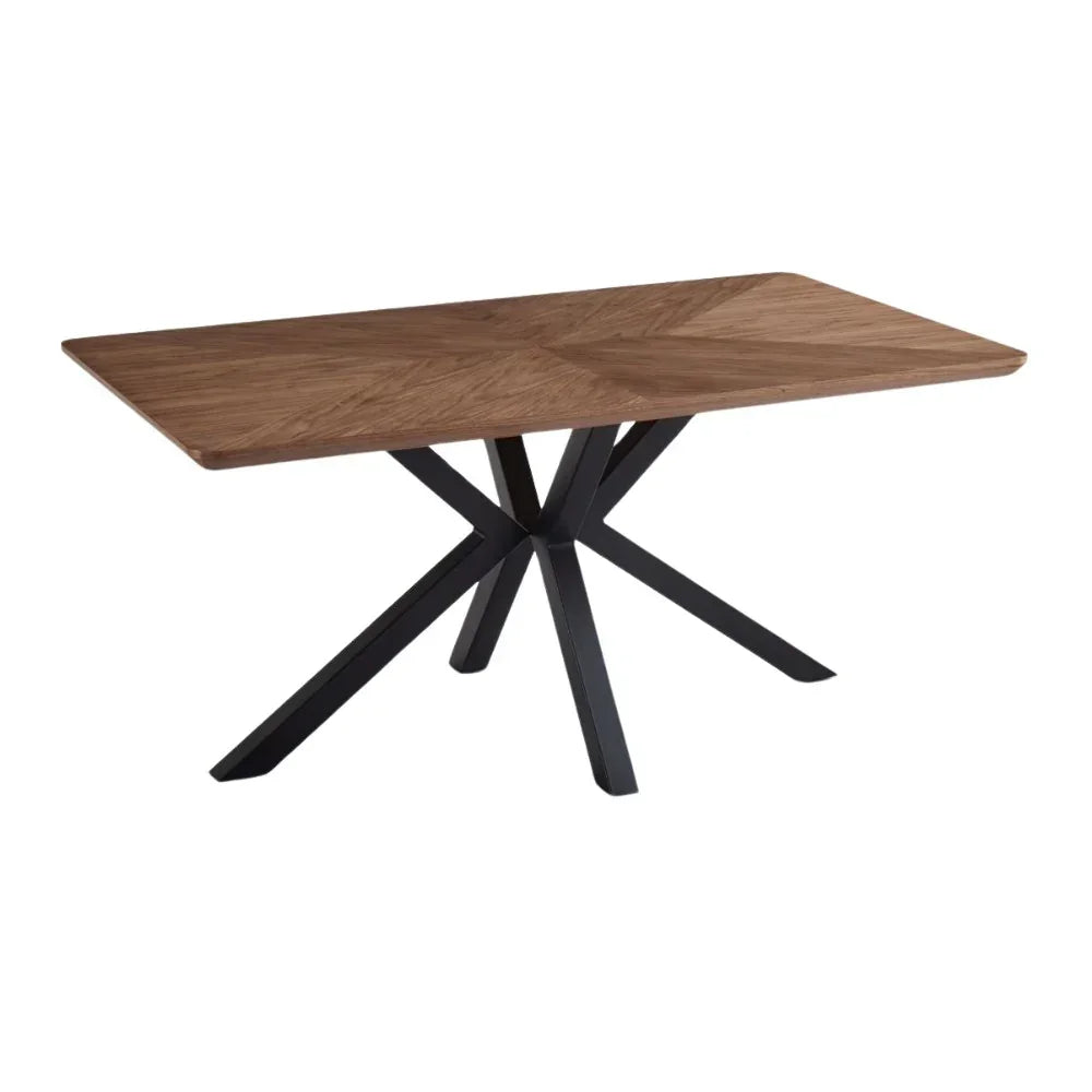 Rectangular wooden dining table with black metal star-shaped legs