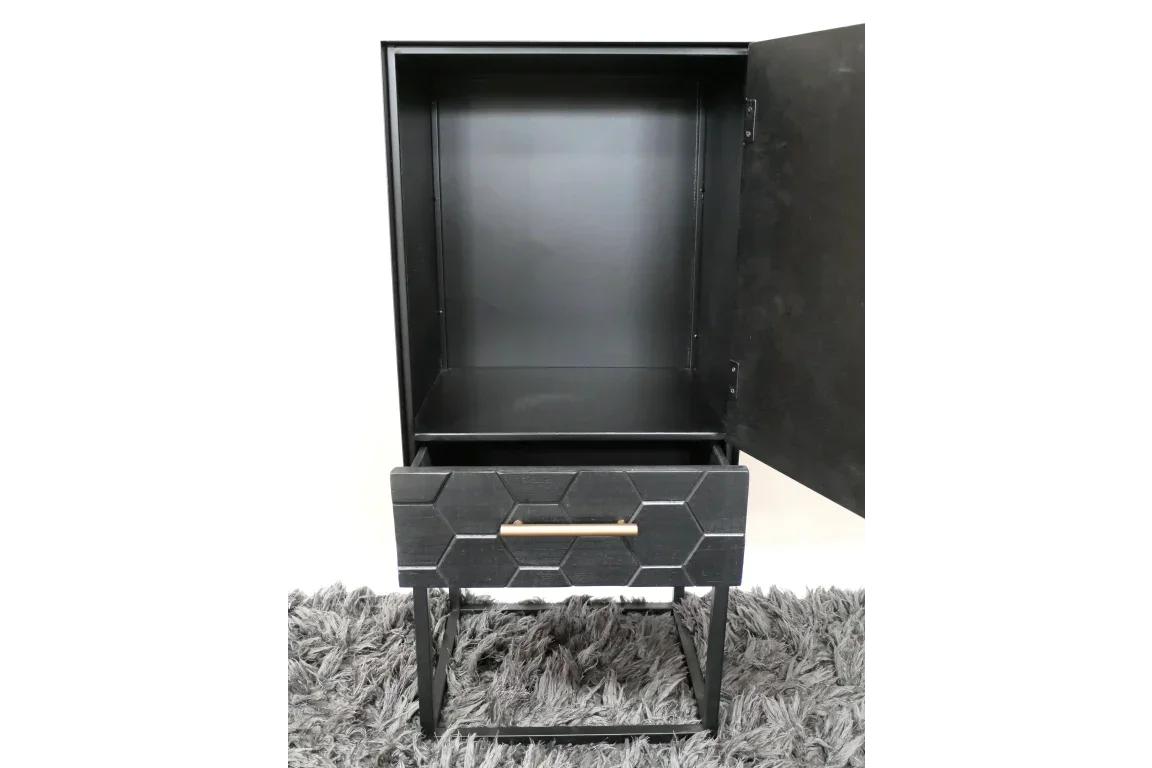 Black bedside table with hexagon drawer front and open cabinet on grey rug