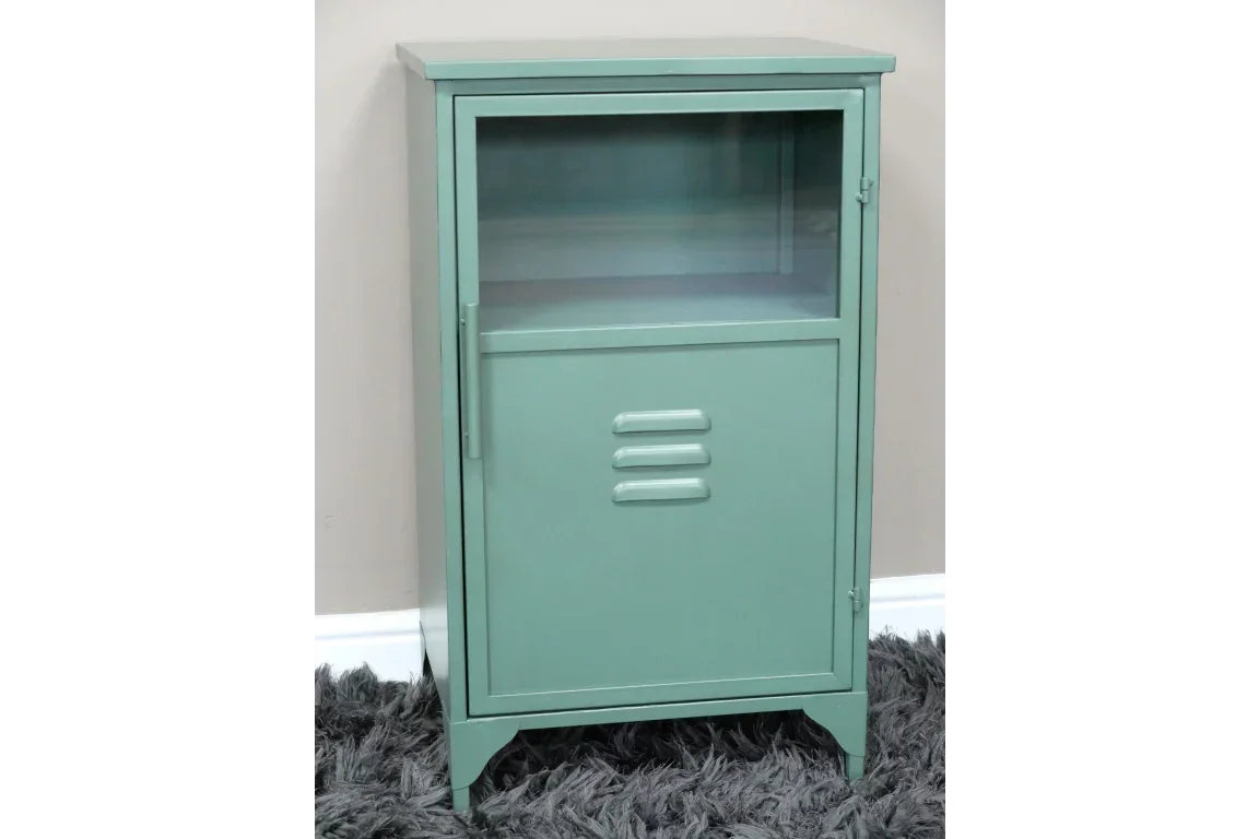 Green metal storage cabinet with glass upper section and vented lower door on grey rug