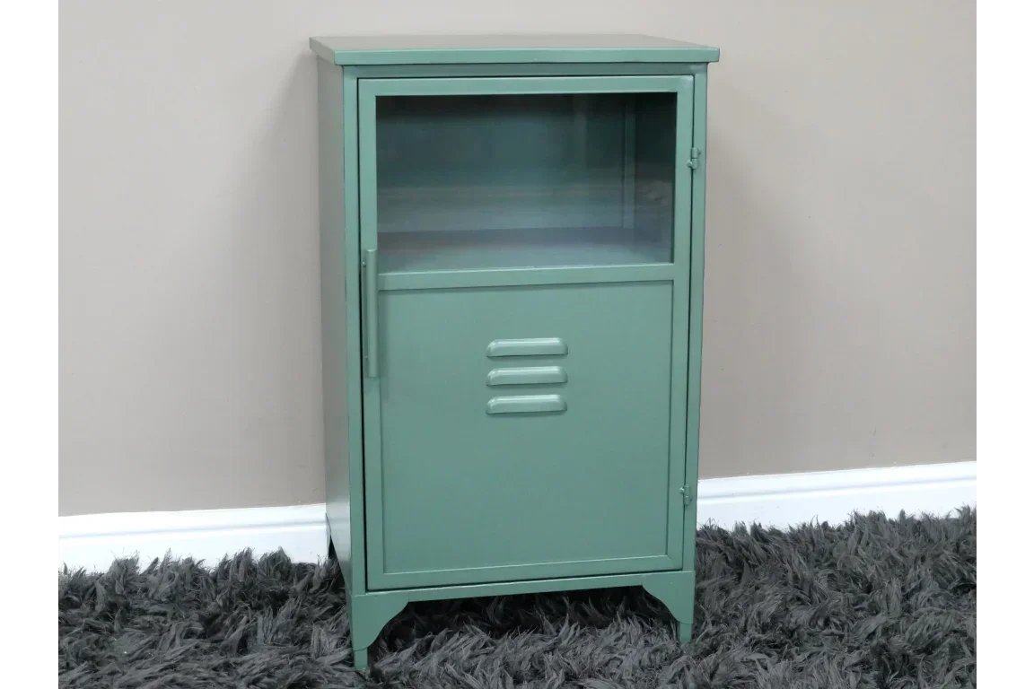 Green metal storage cabinet with glass door and lower vent detail on carpet