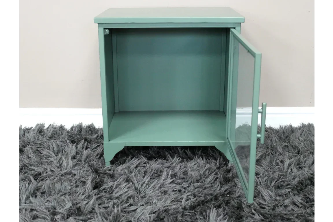 Green bedside cabinet with glass door open, displayed on a grey textured rug