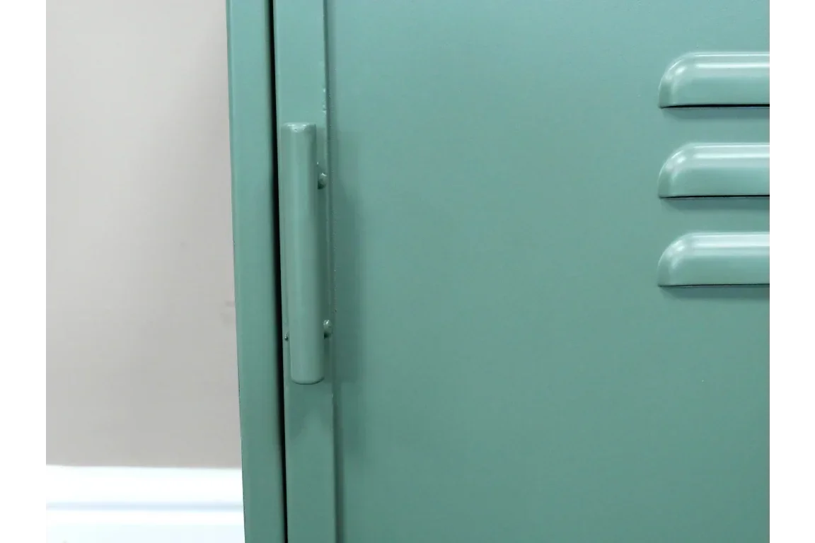 Closeup of green metal locker cabinet door with handle and vented detail