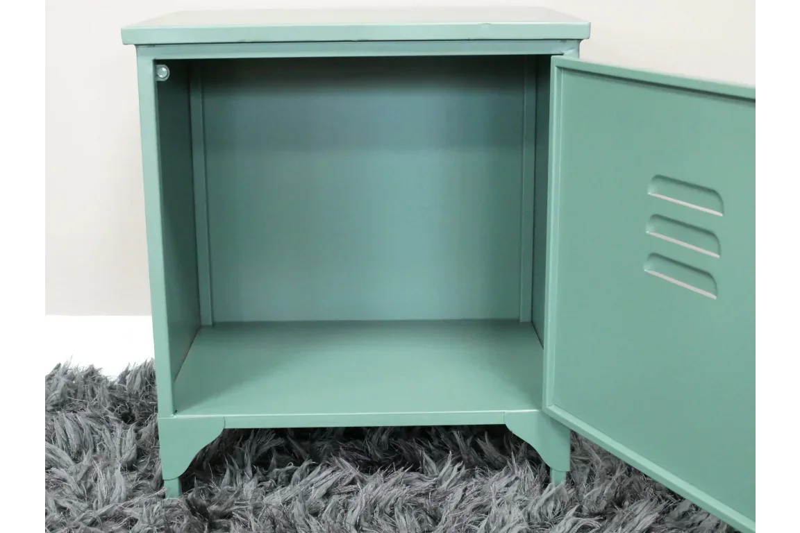 Green metal bedside cabinet with open door on grey rug