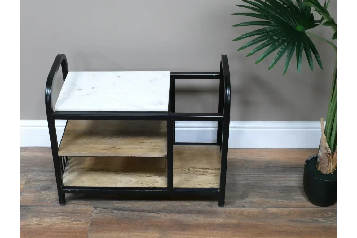 Marble and wood side table with black metal frame and shelves on wooden floor