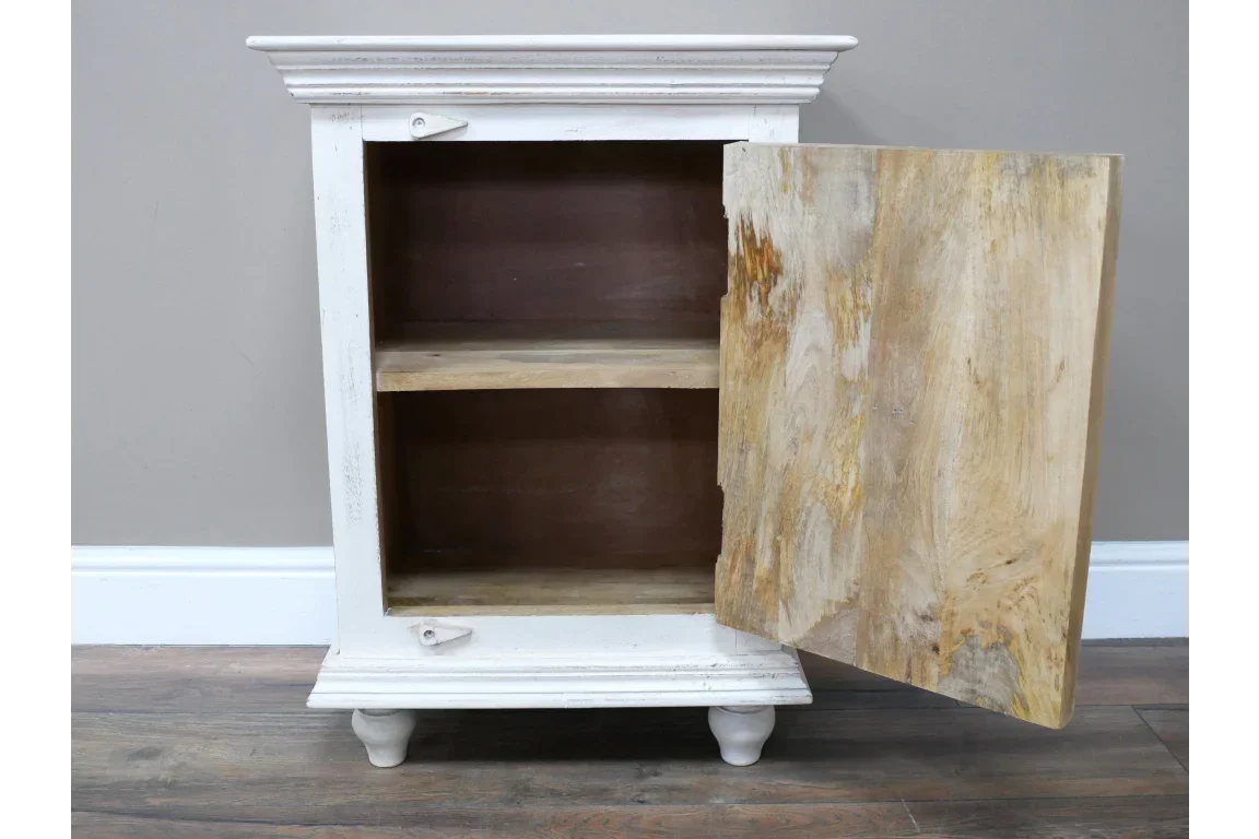 White wooden storage cabinet with open door and internal shelf on wooden floor