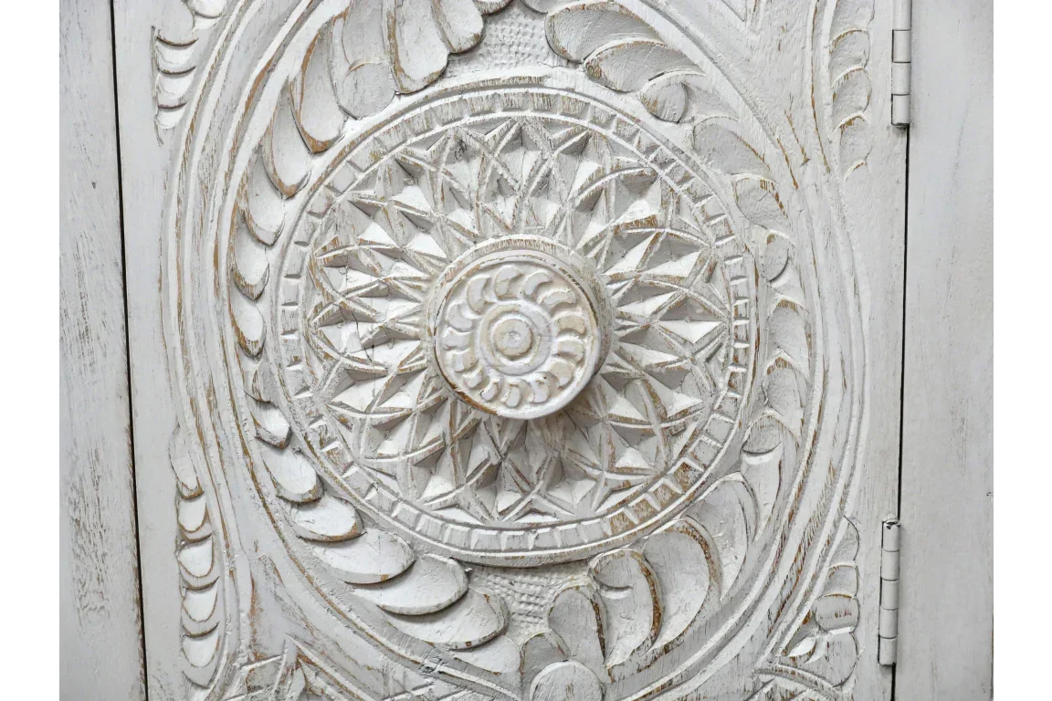 Distressed white carved wood cabinet door with intricate floral and geometric detailing
