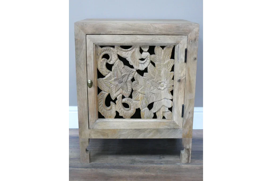 Wooden bedside cabinet with floral carved door and natural finish