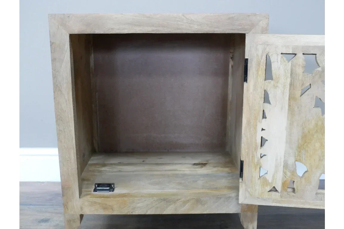 Open wooden storage cabinet with carved door panel and natural wood grain finish