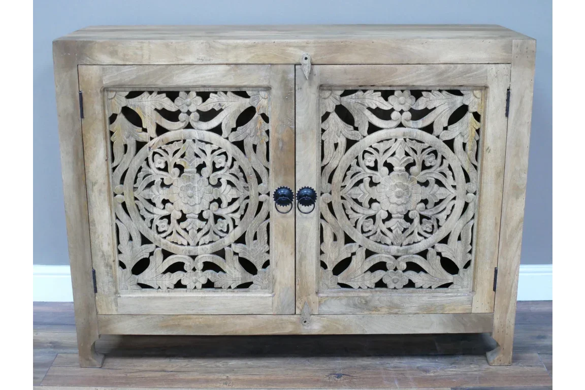 Natural wood sideboard with floral carved doors and black round metal handles