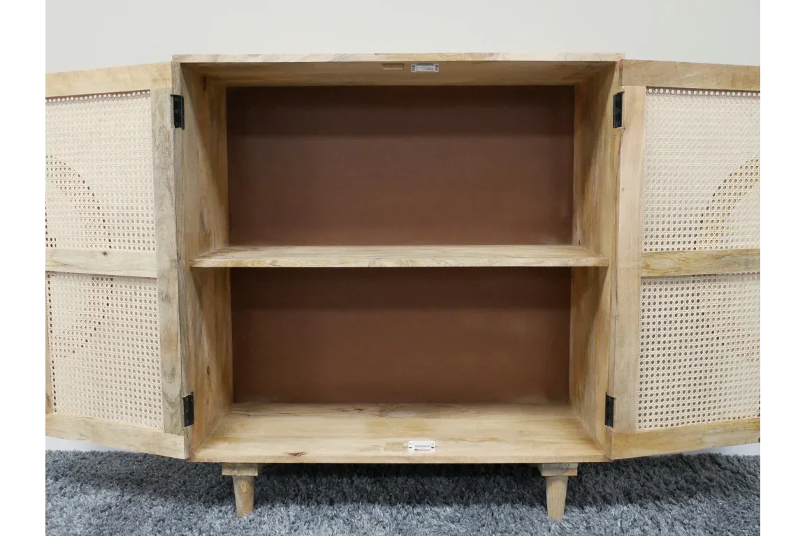 Natural wood sideboard with open double doors, cane panels and internal shelf on grey carpet
