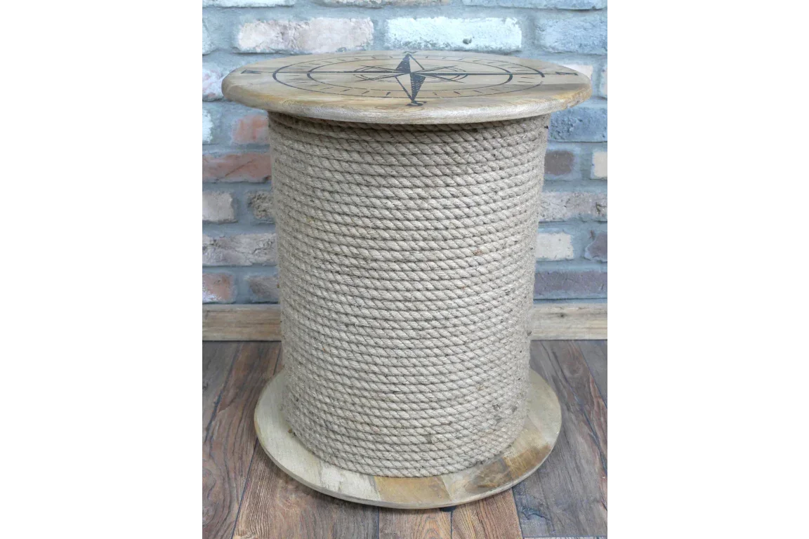 Round rope side table with wooden top featuring a compass design, placed on wooden floor