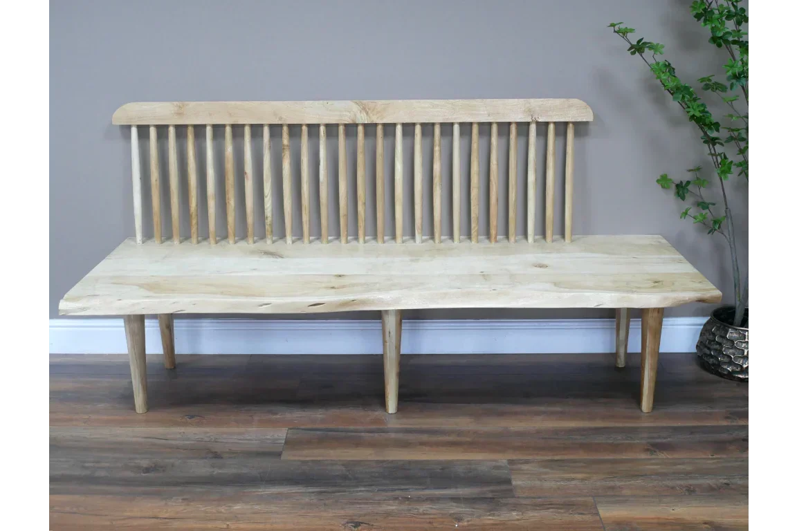 Natural wood bench seat with spindle backrest, angled legs and live edge detail