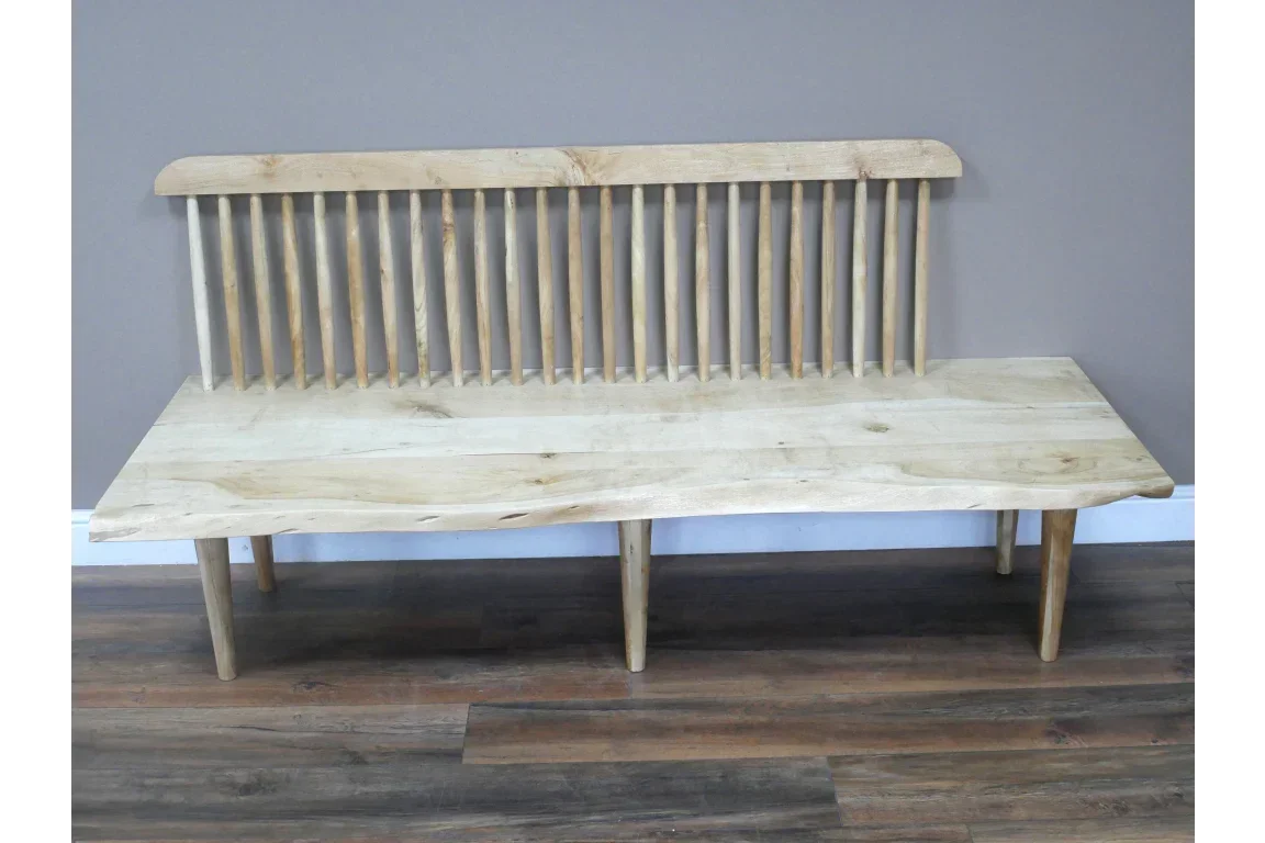 Solid wood bench with spindle backrest and natural finish on wooden floor