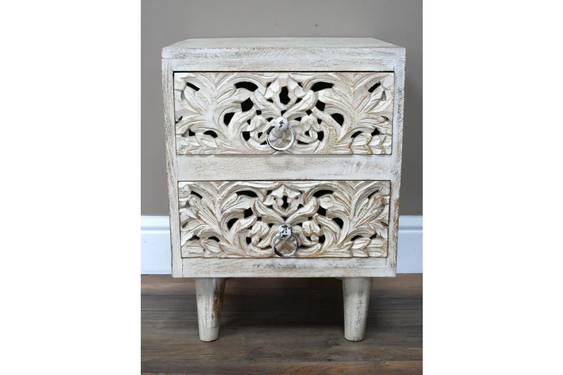 Carved wood bedside table with two drawers and distressed white finish