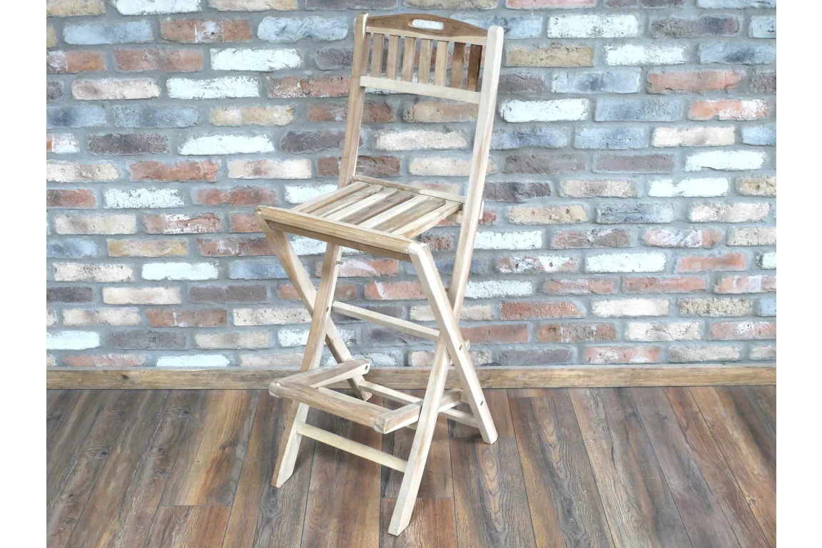 Folding wooden bar stool with slatted seat and backrest on wood floor