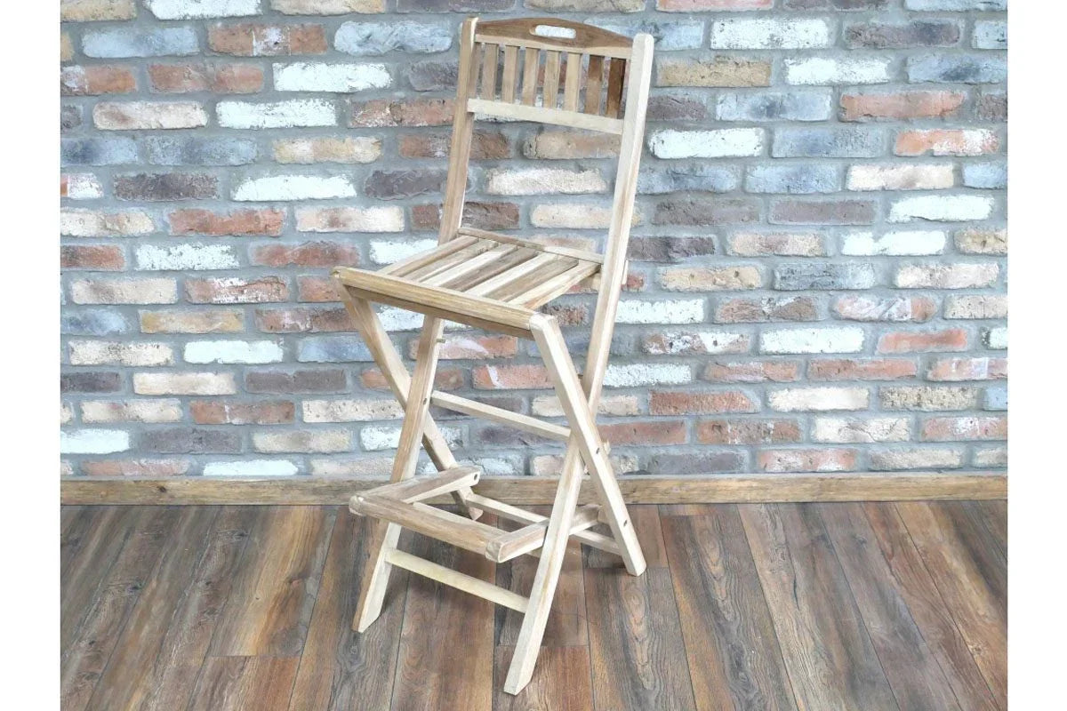 Folding wooden bar stool with slatted seat and backrest on wooden floor