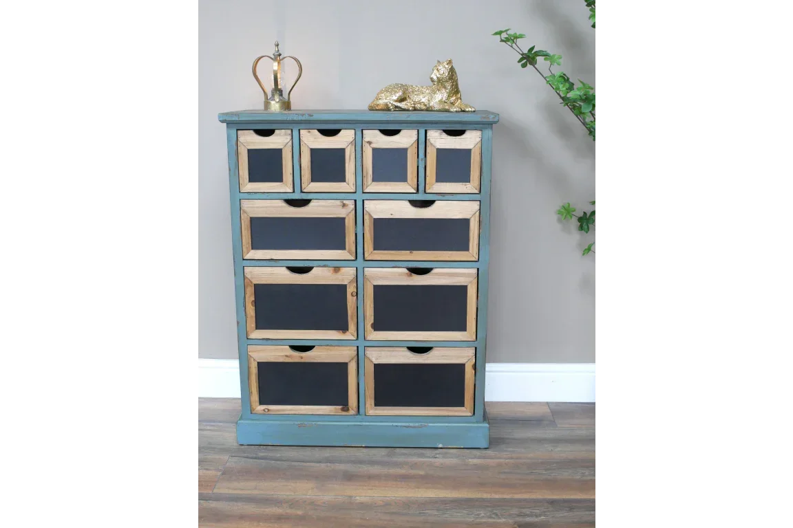Rustic wooden chest of drawers with black panel fronts in entryway setting
