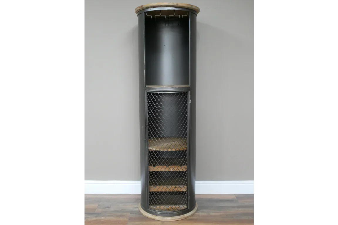 Black corner cabinet with mesh door and wooden shelves against grey wall