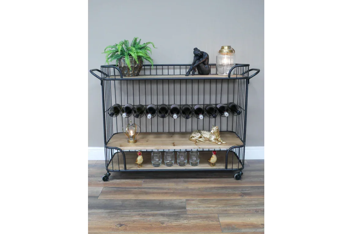 Industrial style black metal and wood drinks trolley with wine rack and decorative items