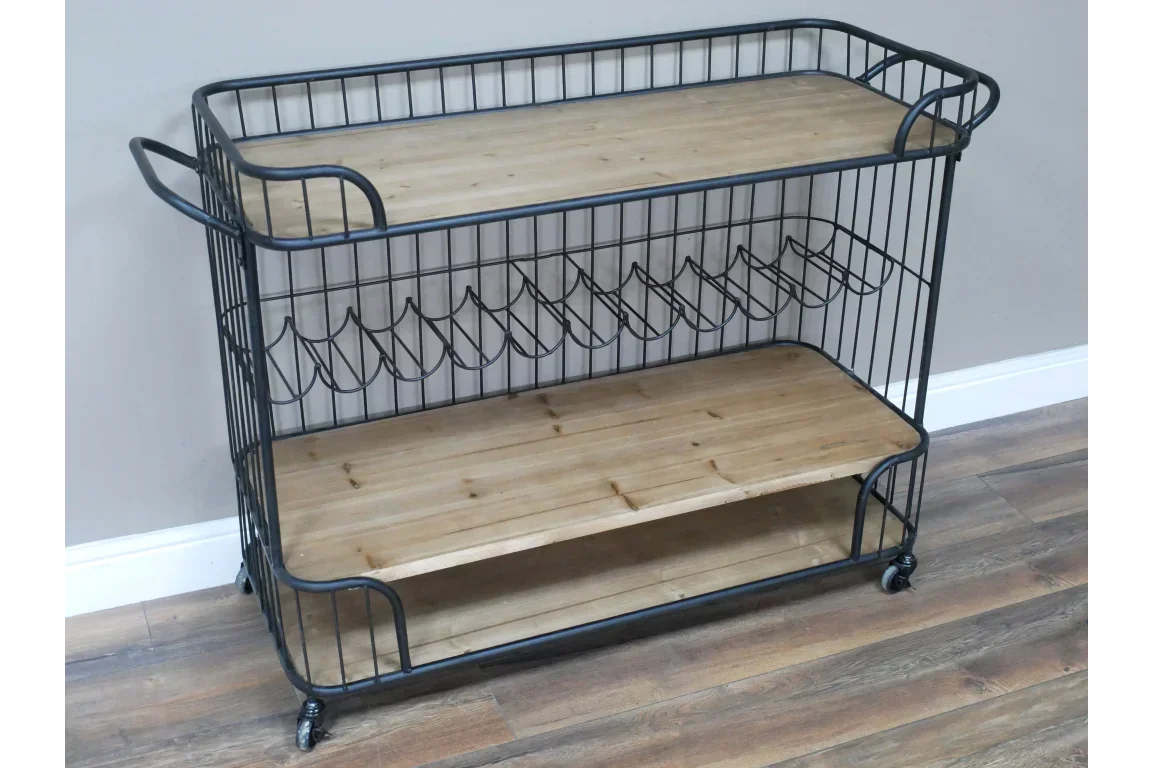 Industrial style wooden and metal bar cart with wine rack and wheels on hardwood floor