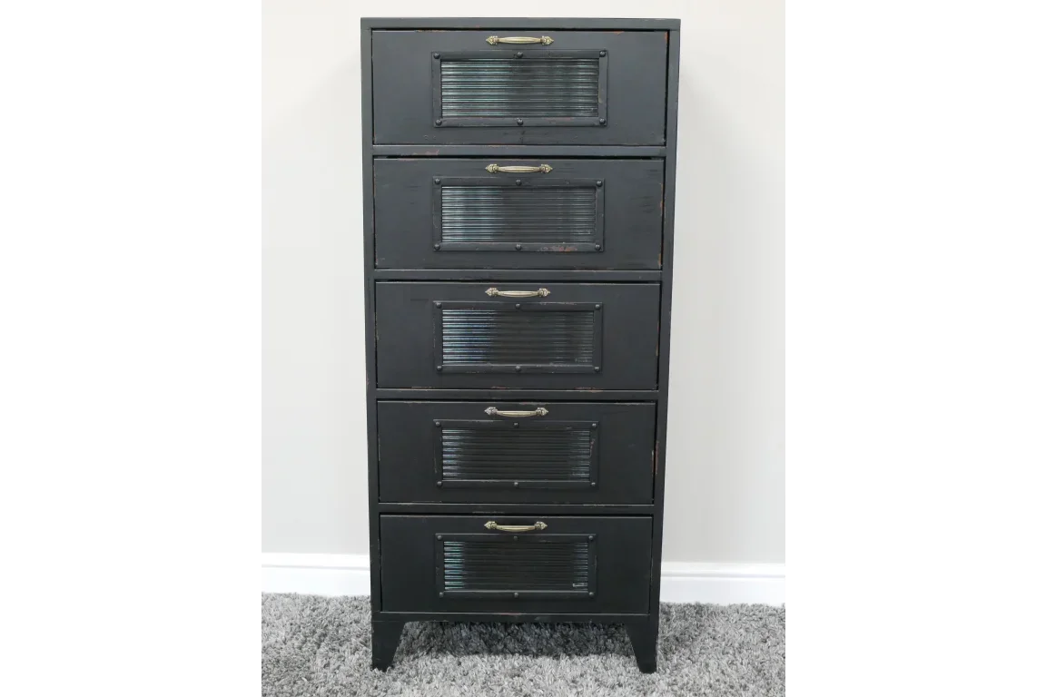 Black metal chest of drawers with five compartments and brass handles on grey carpet