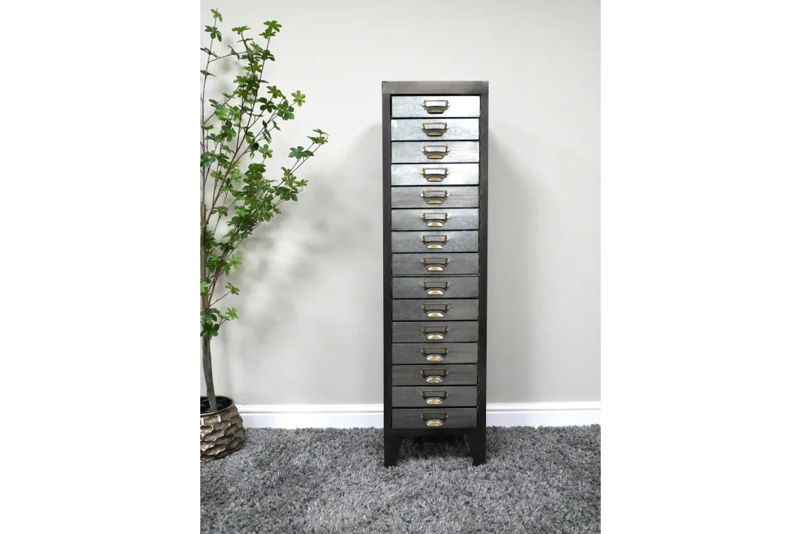 Tall metal storage cabinet with 12 drawers and brass handles on grey carpet