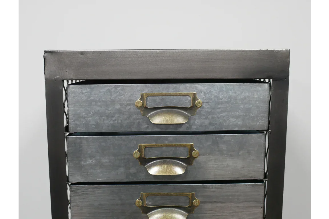 metal chest of drawers with brass handles, industrial storage furniture close-up