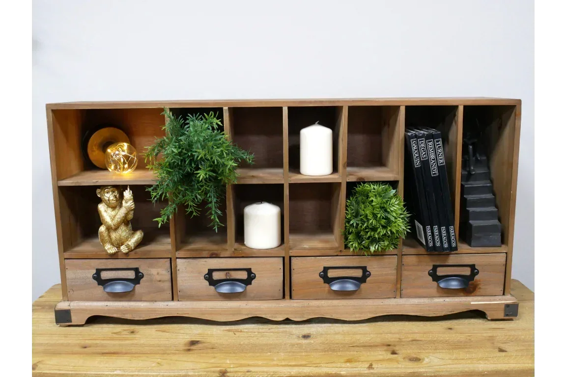 Wooden storage unit with cubby shelves, three drawers, candles, plants, and decorative items