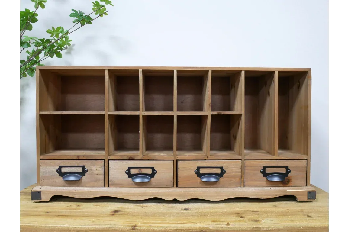 Rustic wooden storage organiser with open cubbies and four metal-handled drawers on tabletop