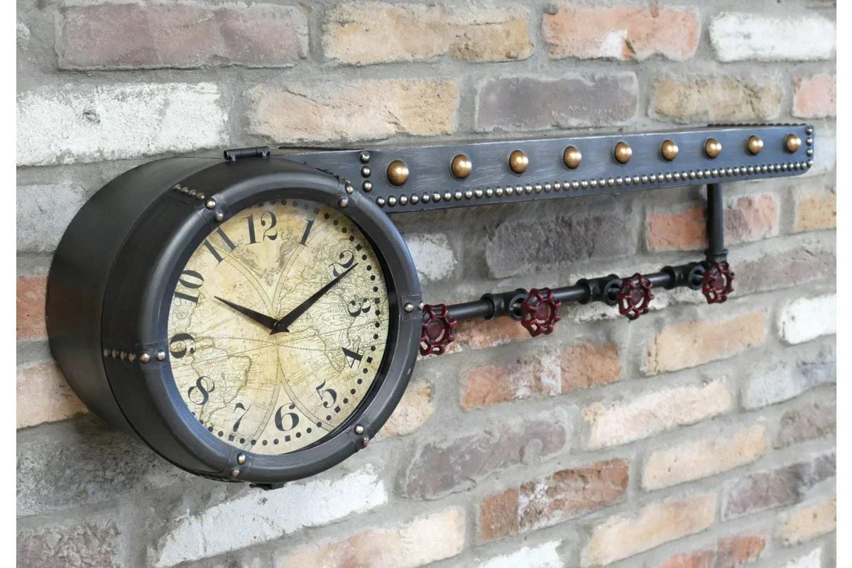 Industrial wall clock with metal frame and vintage map face on exposed brick wall