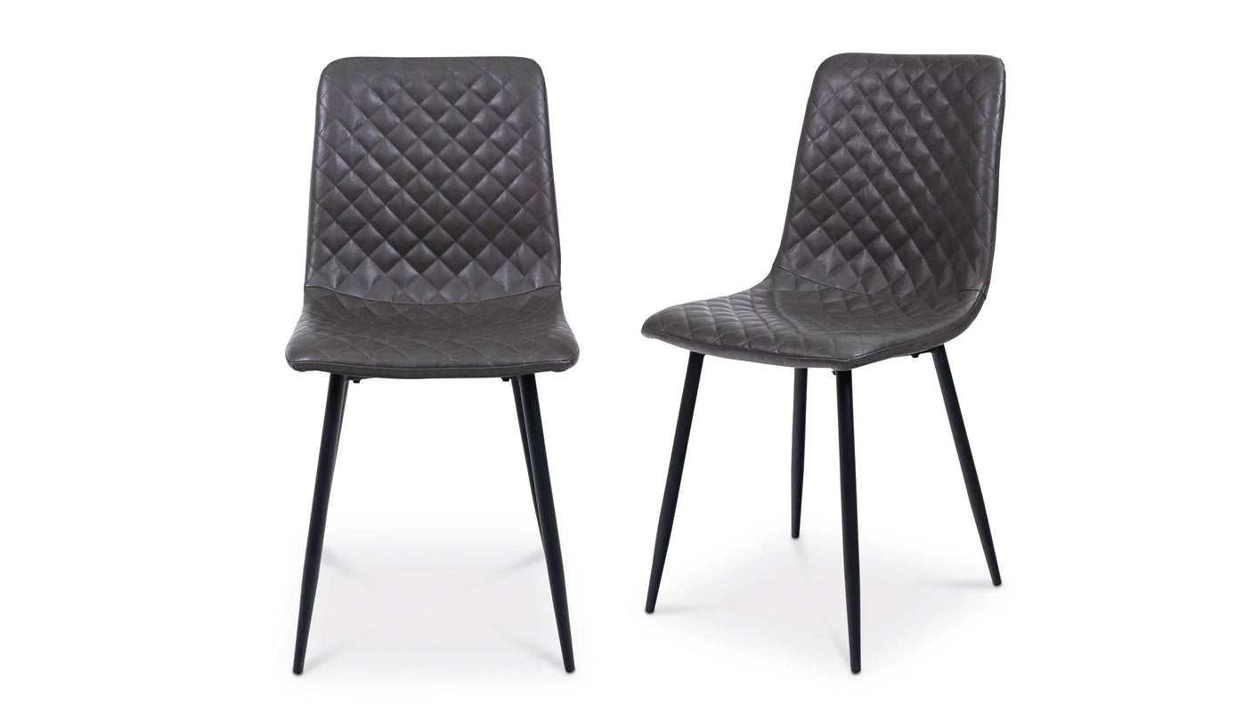 Set of two grey dining chairs with diamond-stitched upholstery and black metal legs