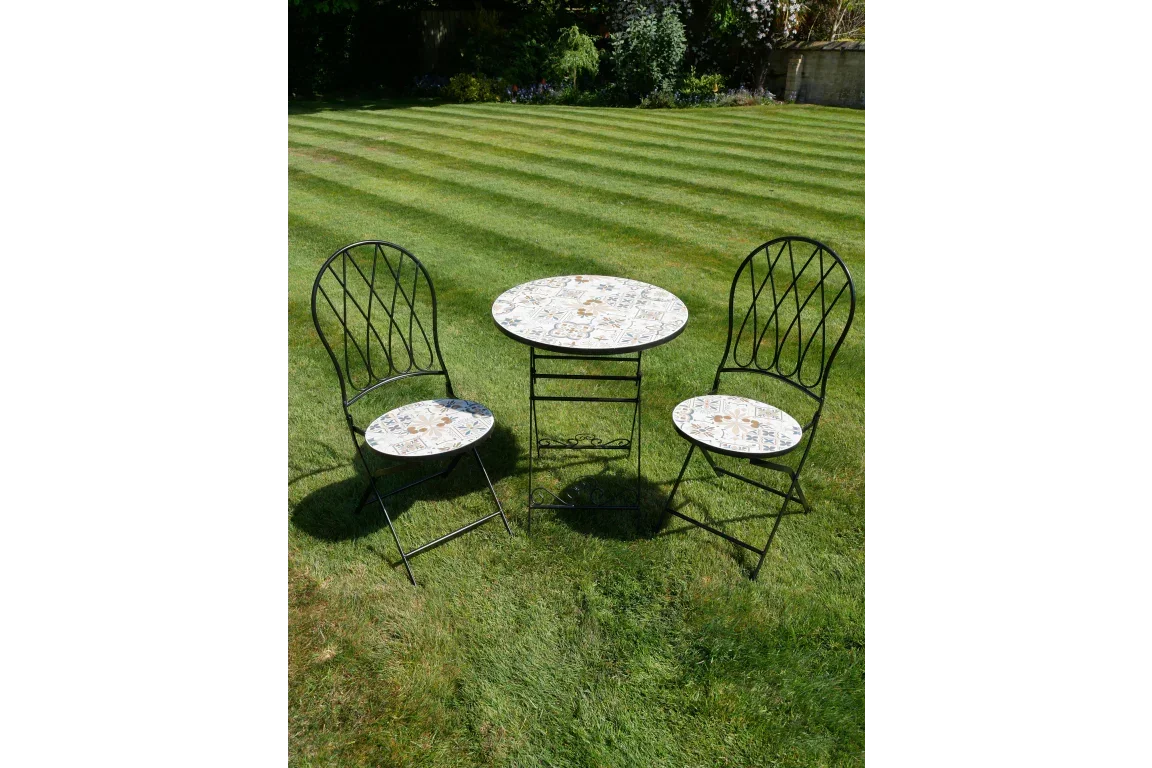 Mosaic bistro garden furniture set with round table and two chairs on lawn