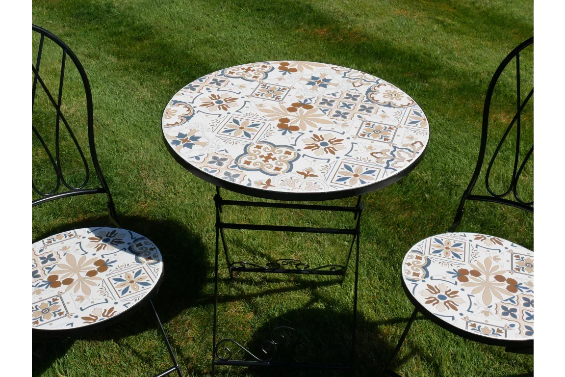 Mosaic garden bistro set with round tile table and two chairs on grass