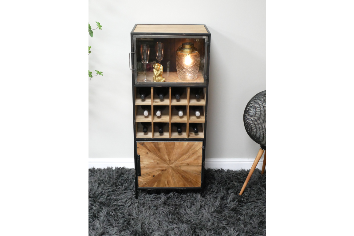Tall wine cabinet with black metal frame, light wood shelves and decorative door, displayed on gray carpet.