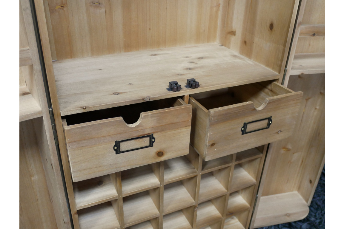 Light wood wine cabinet with two open drawers, grid-style cubbyholes for bottles, shown at a slight angle.