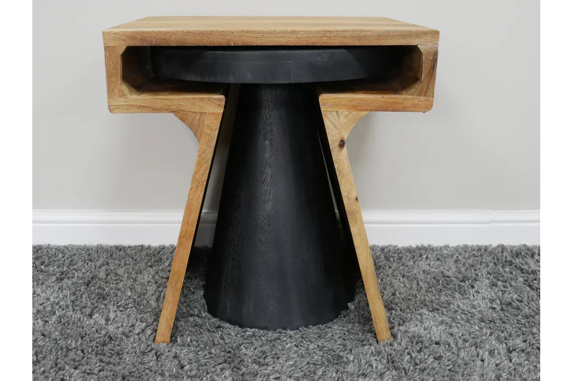 Modern wood and black side table with open shelf on grey carpet