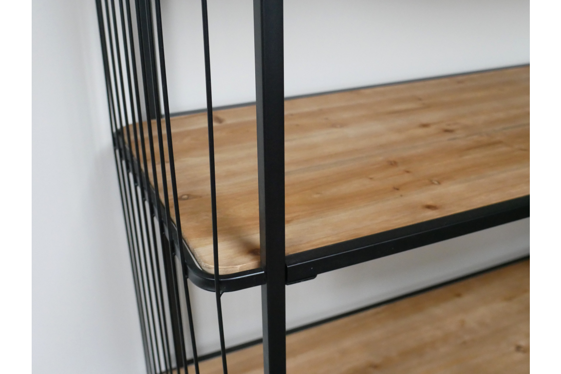 Close-up angled view of wooden shelves with black metal frame and vertical bars on wheels.