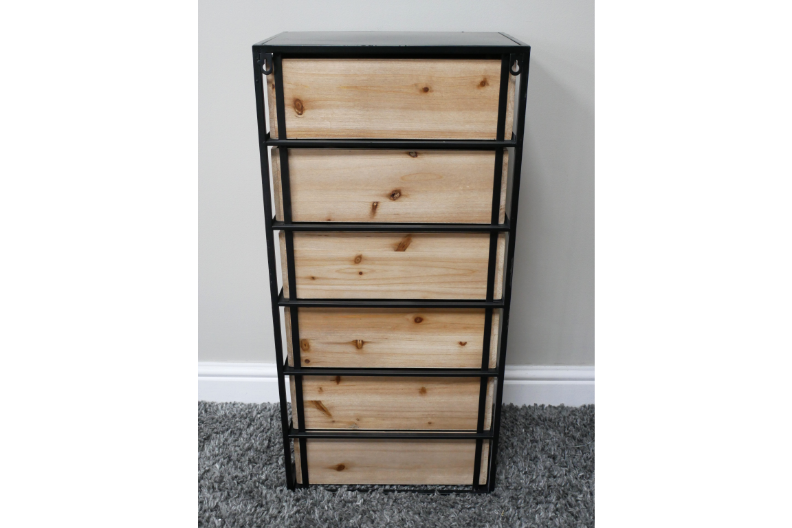 Industrial drawer cabinet with five light wood drawers and black metal frame, front view on carpeted floor.