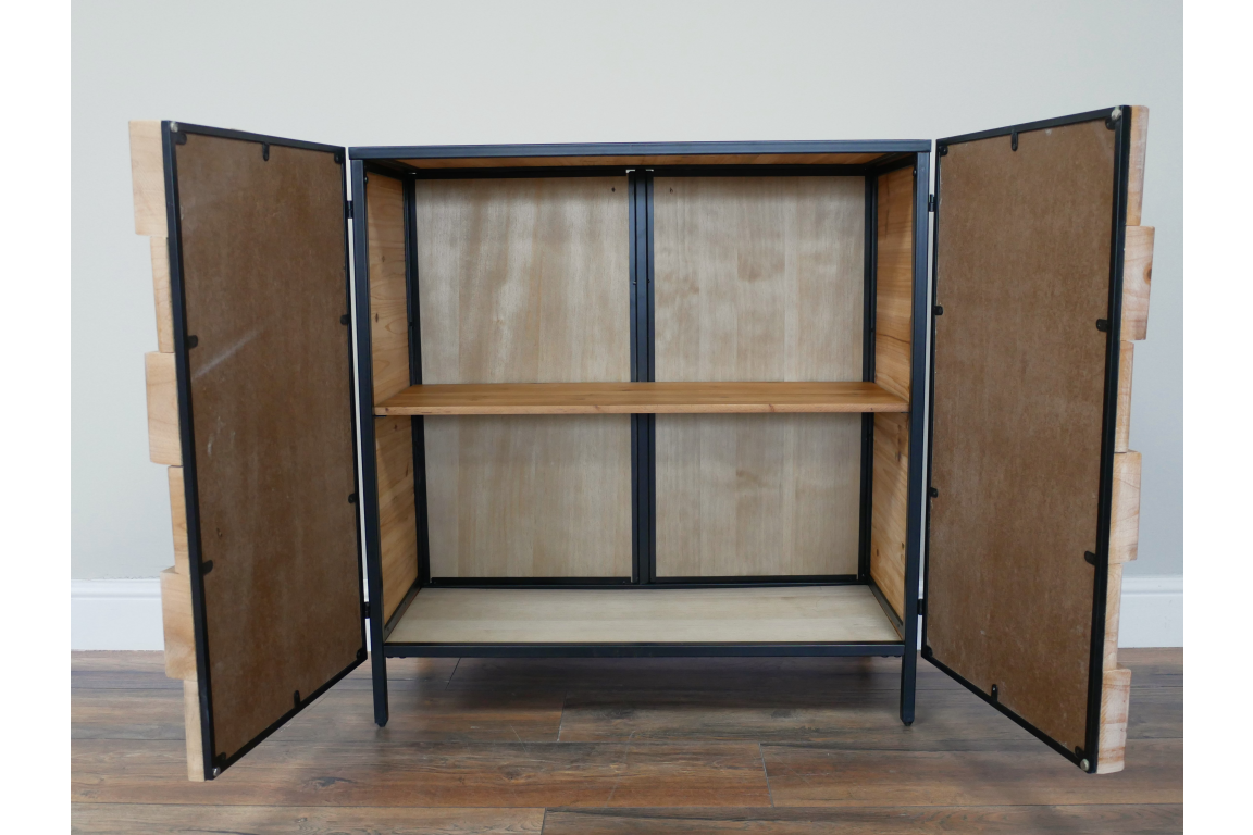 Chunky wooden cabinet with open double doors, black metal frame, one wooden shelf, shown from front angle on wood floor.