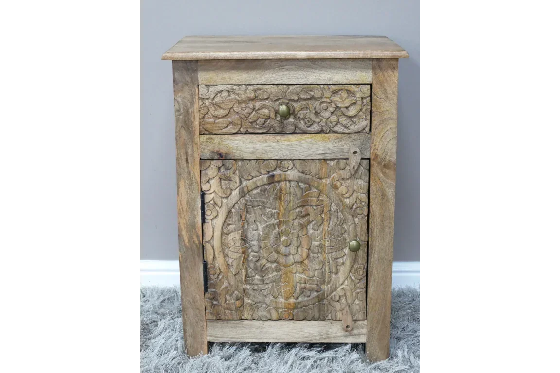 mango wood bedside cabinet with carved floral panel and drawer, rustic style on grey rug
