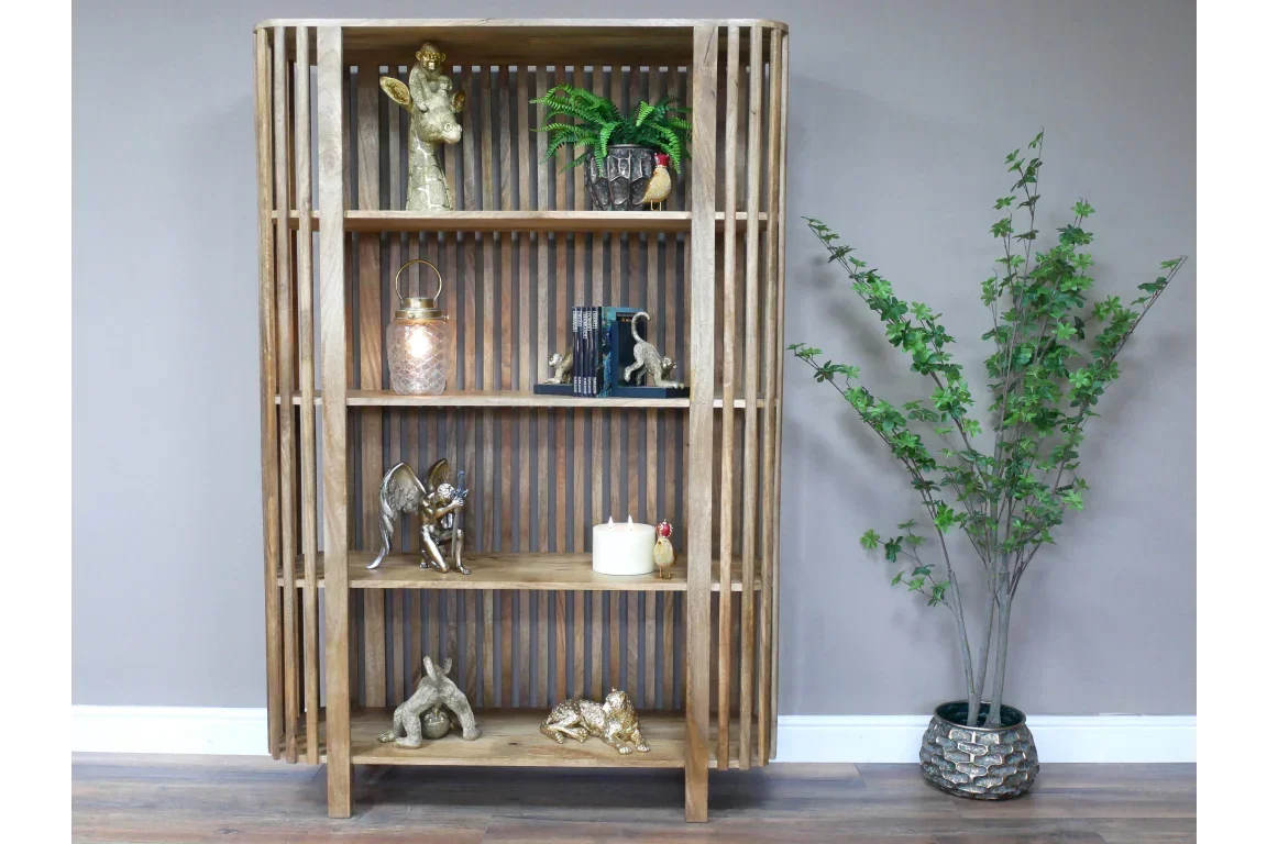 Contemporary wooden bookcase with open slatted sides styled with ornaments and books