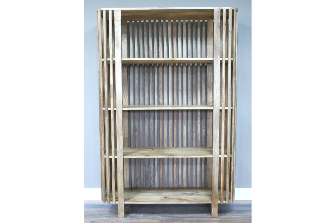 Natural wood bookcase with slatted sides and four shelves against a grey wall
