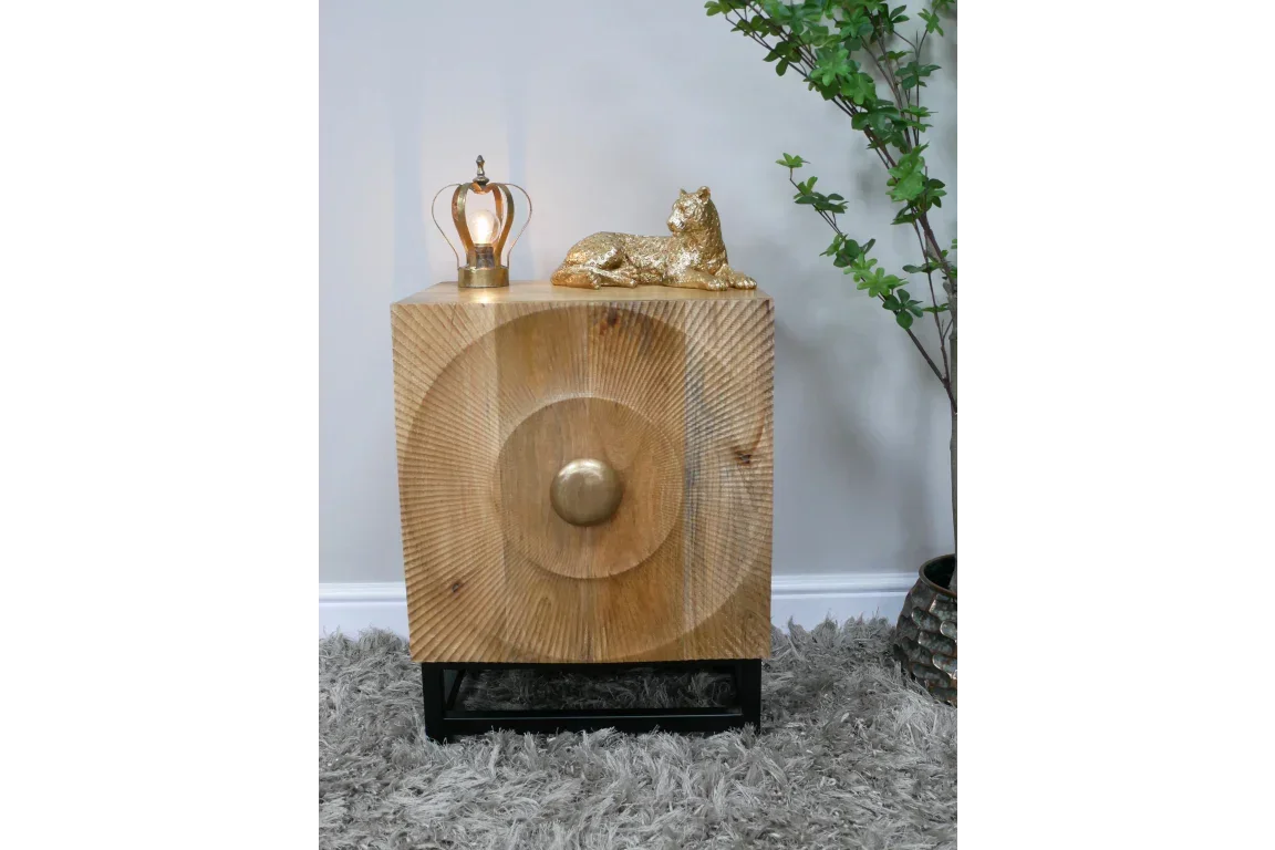 Square wooden side table with circular carved detail and gold knob on black base